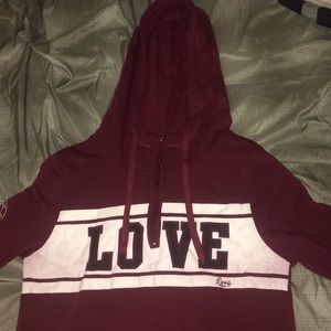 A burgundy love university sweater